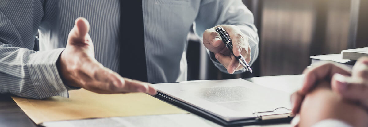 Defense Attorney Taking Notes During Free Consultation